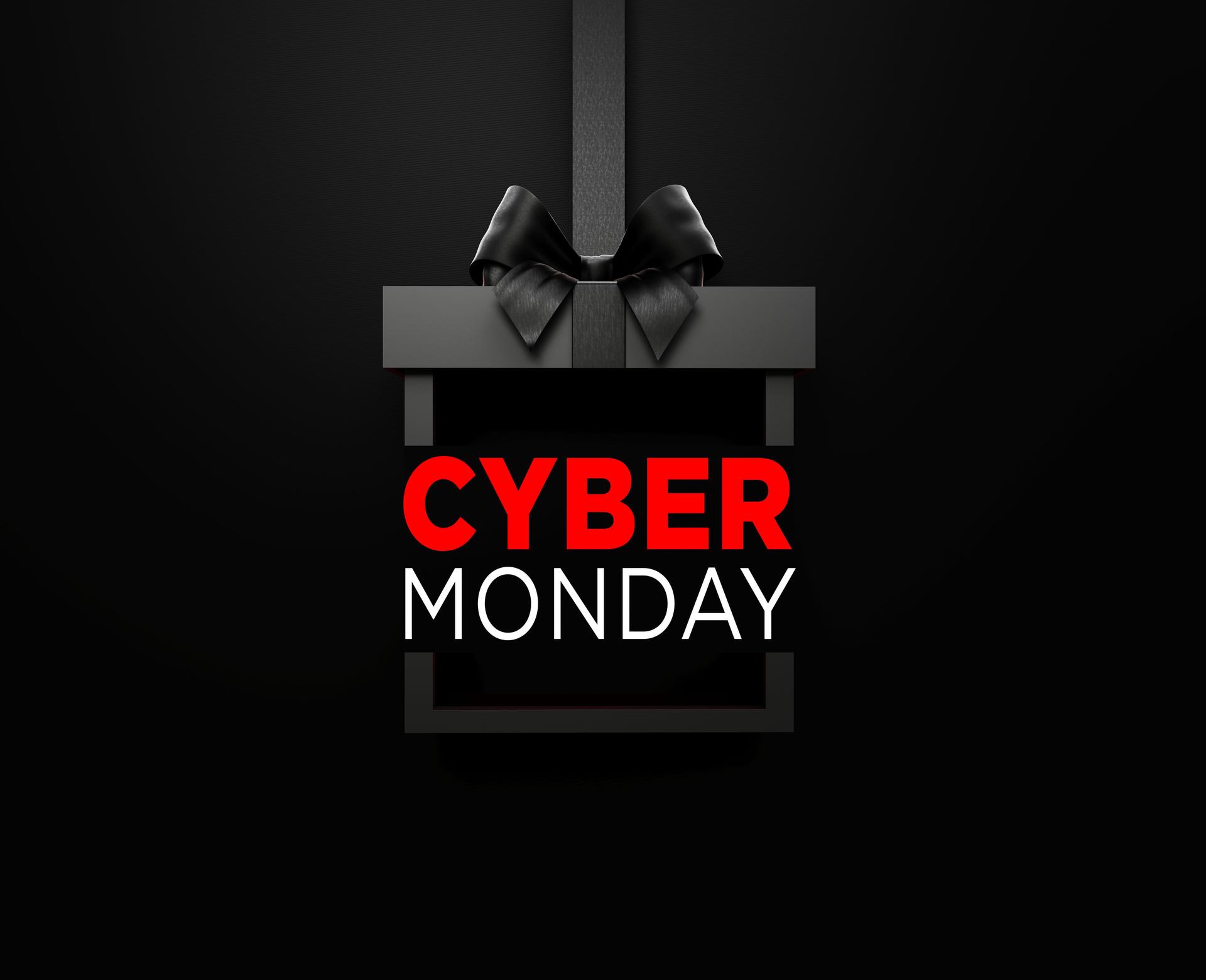 Cyber Monday Text Sitting Inside Of A Black Gift Box Tied With Black Ribbon On Black Background