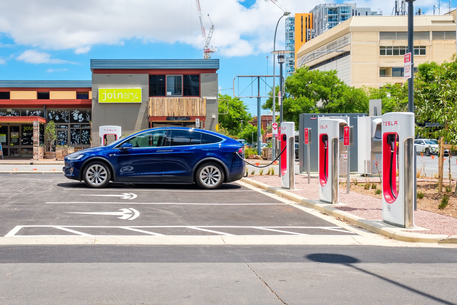 Tesla Model X car and Tesla Supercharger